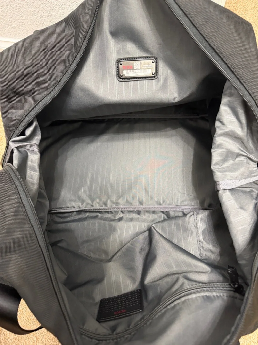 Tumi Black Travel Duffel with Red Logo Accent
